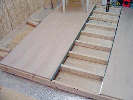 Plywood was placed on top after each module was fastened to the concrete floor.