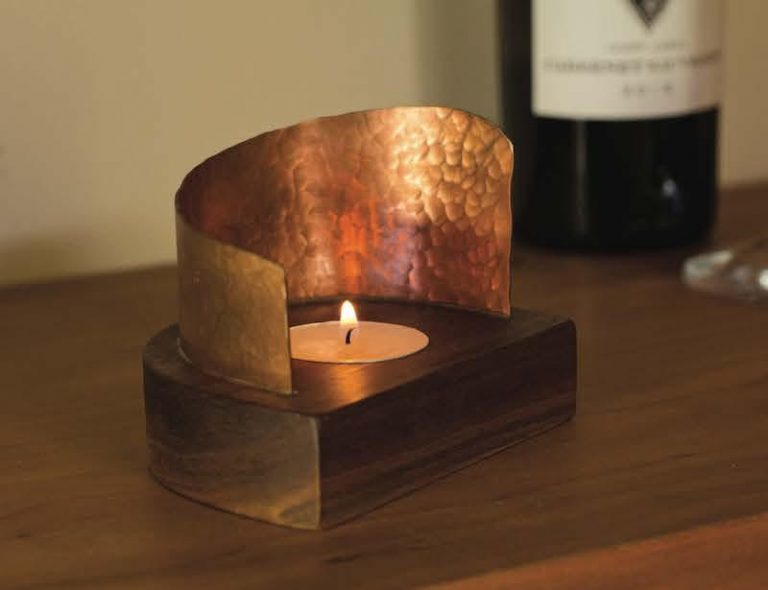 Tea light holder with a planished copper reflector
