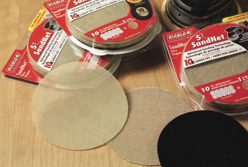 Net-backed abrasive sanding discs