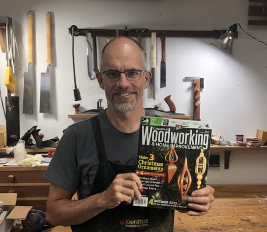 Rob Brown with Dec Jan 2021 issue with Christmas ornaments