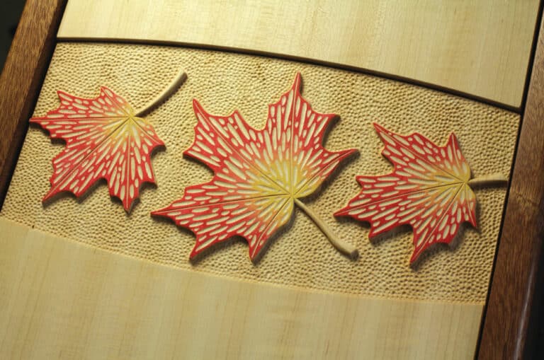 Carved maple leaf doors