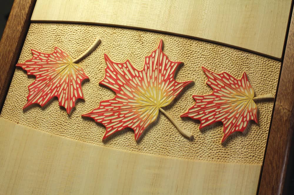 >Carved maple leaf doors